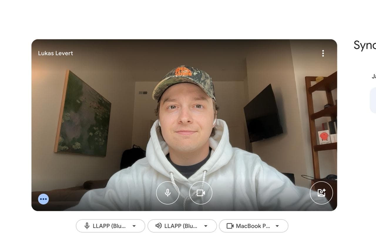 Lukas Levert wearing a cap and a light hoodie